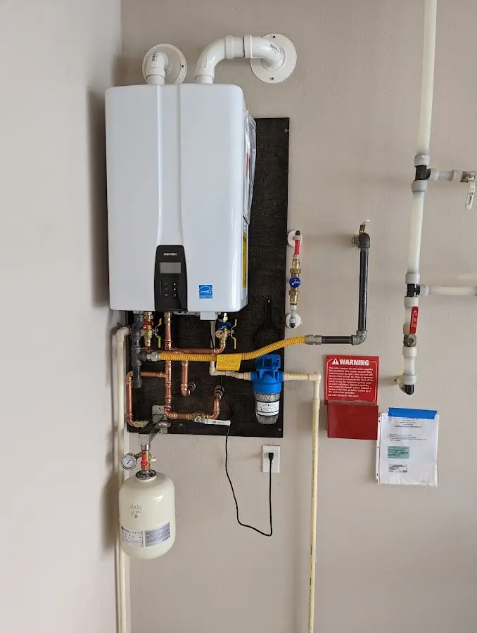 Professional plumber installing copper piping in a Ladson home
